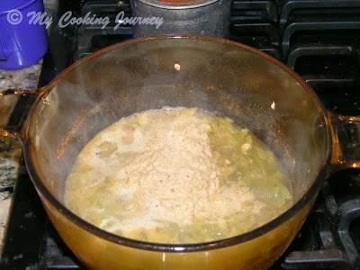Cooking the paste with Snake gourd in a cooker