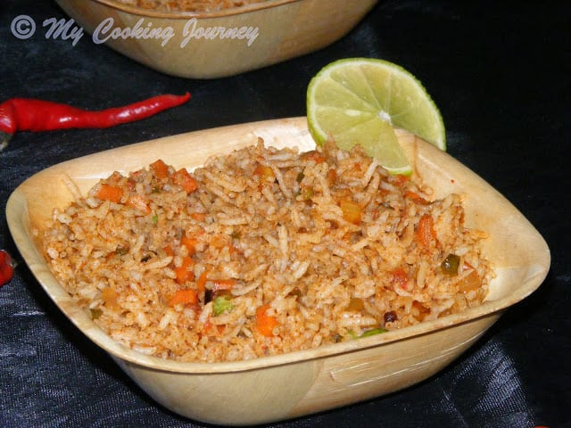 Tawa Pulao served with lemon slice.