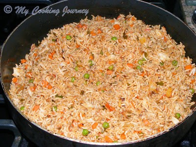 Rice in a pan with the other ingredients.
