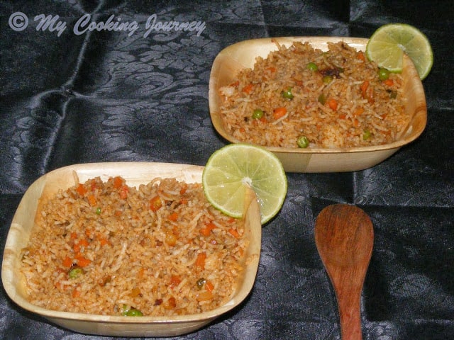 Tawa Pulao in two bowl with lemon.