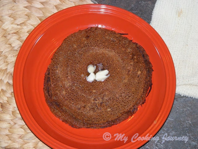 Instant Vellam Dosai - Final product in a plate with butter on top