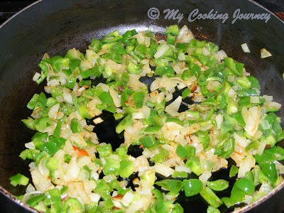 onion and bell pepper in a pan