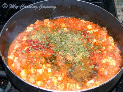 Add the tomatoes pease and the rest of the masala with salt and cook