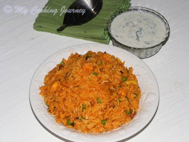 Tamatari Kasoori Pulao in a white glass plate