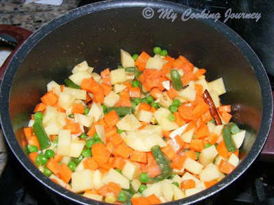 Cooking vegitables in a pot.