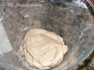 Kneading the dough in a bowl