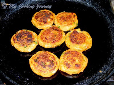 Frying Aloo Tikki.