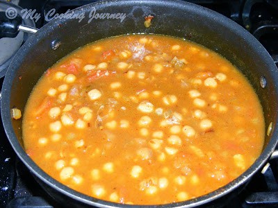 Chole boiling with masala.