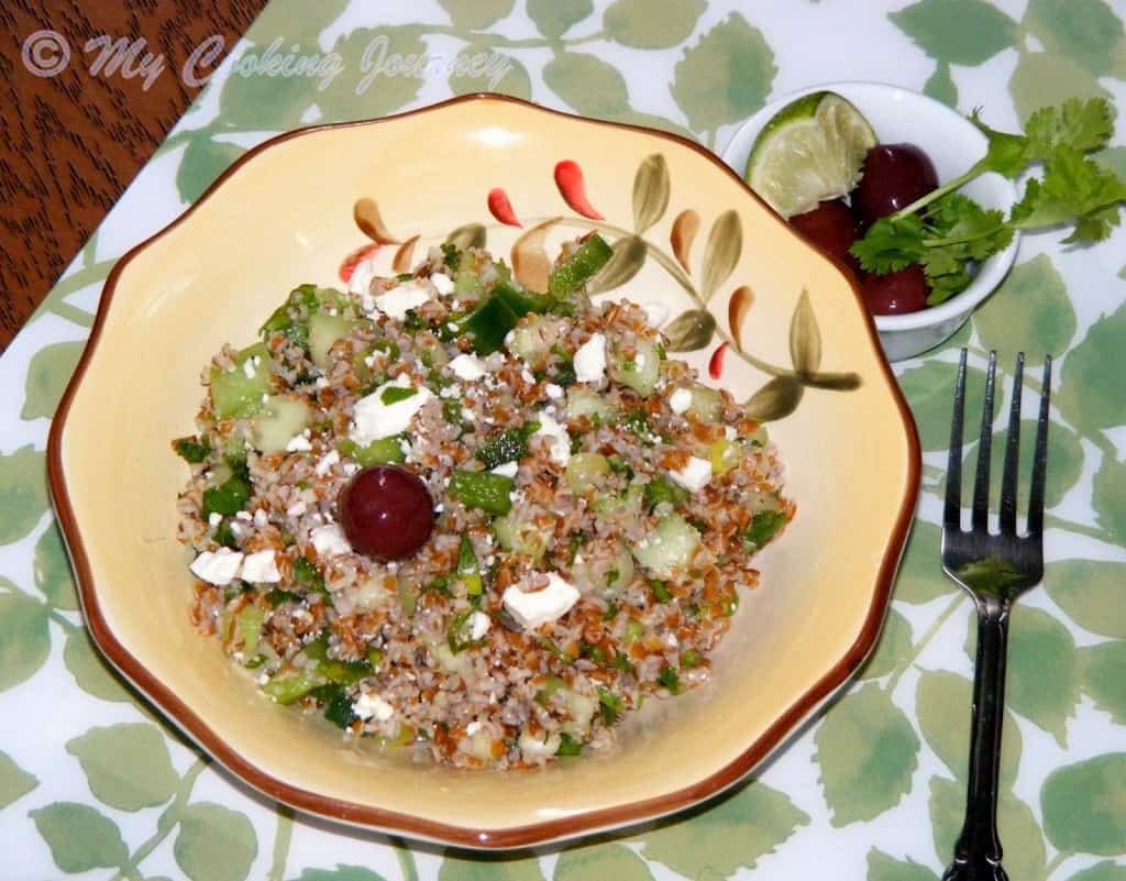 Bulgur Salad served with Lemon and Black Olives.
