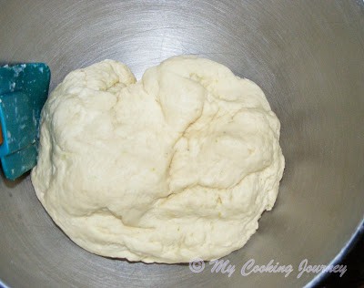 Adding butter in the dough.