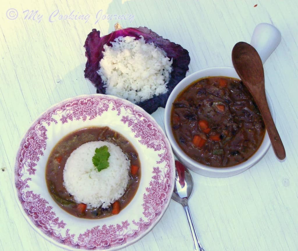 Curried Cabbage in a bowl with spoon