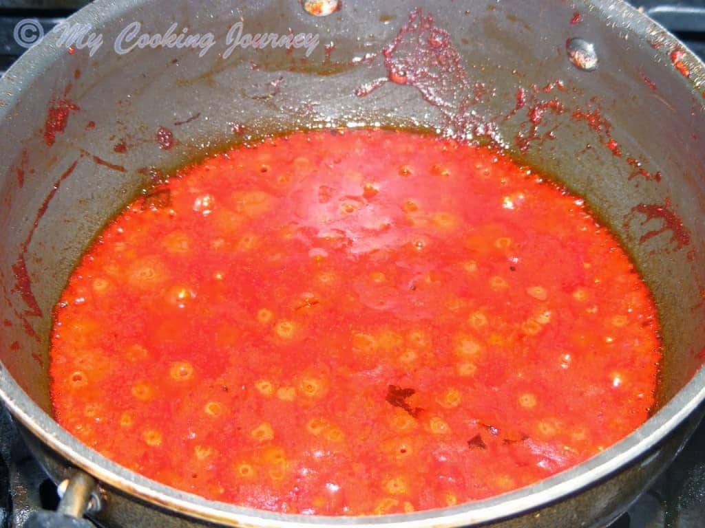 Boiling cranberries to make the pickle