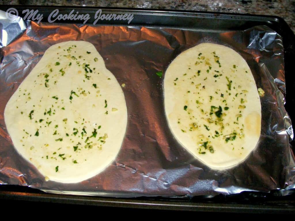 Rolled naan in a baking tray