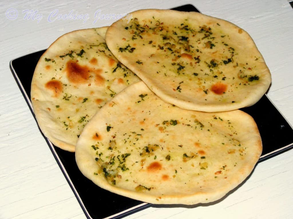 Garlic Nan in a black dish