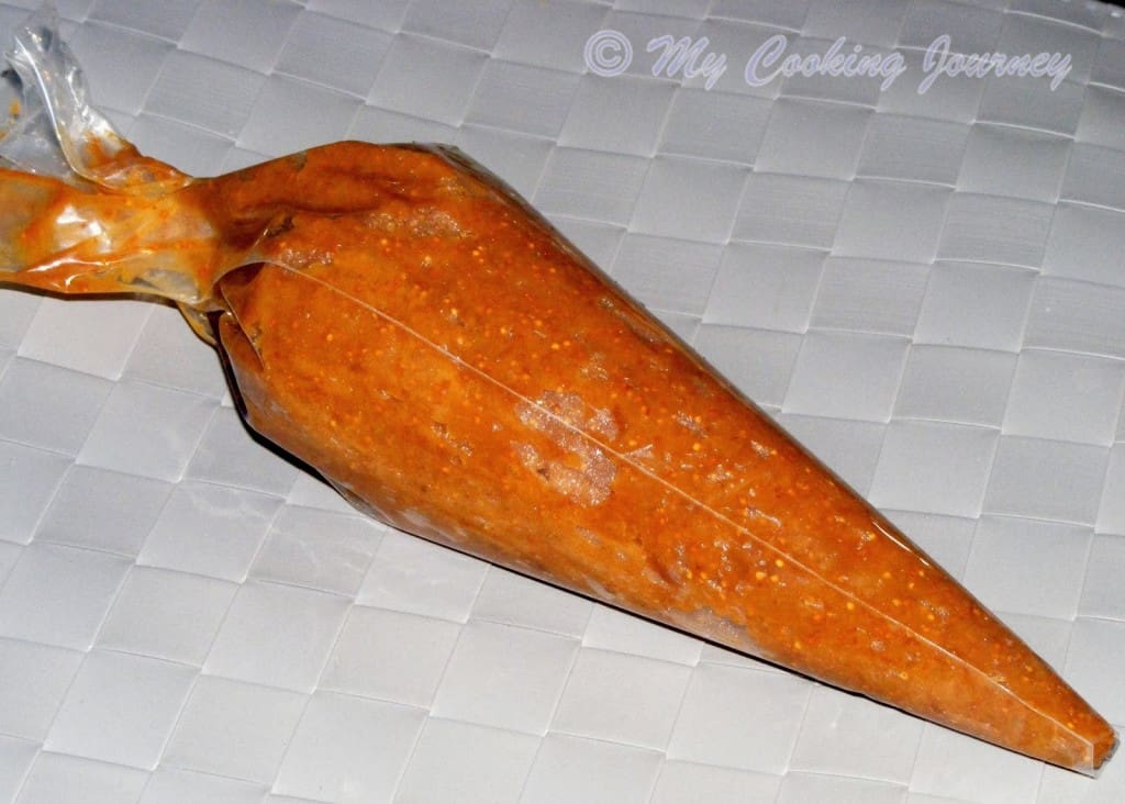 Transferring the pureed fruit to a Pastry bag