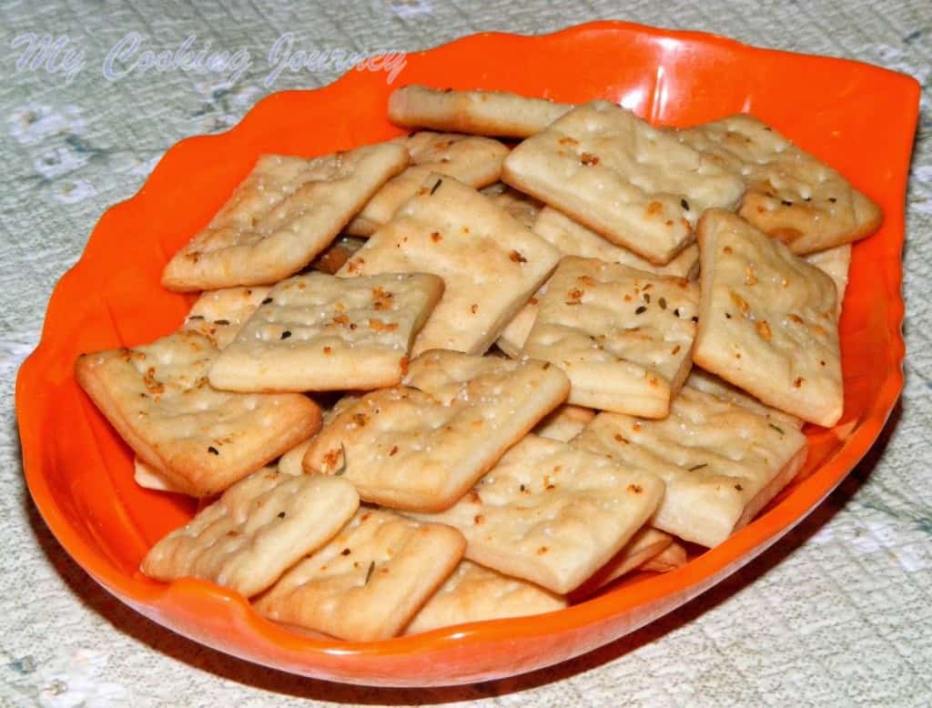 Homemade saltine Crackers in a tray.