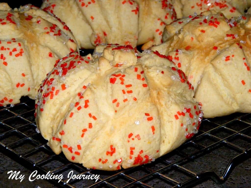 Cookie Covered Bread Rolls on a cooling rack - close up view