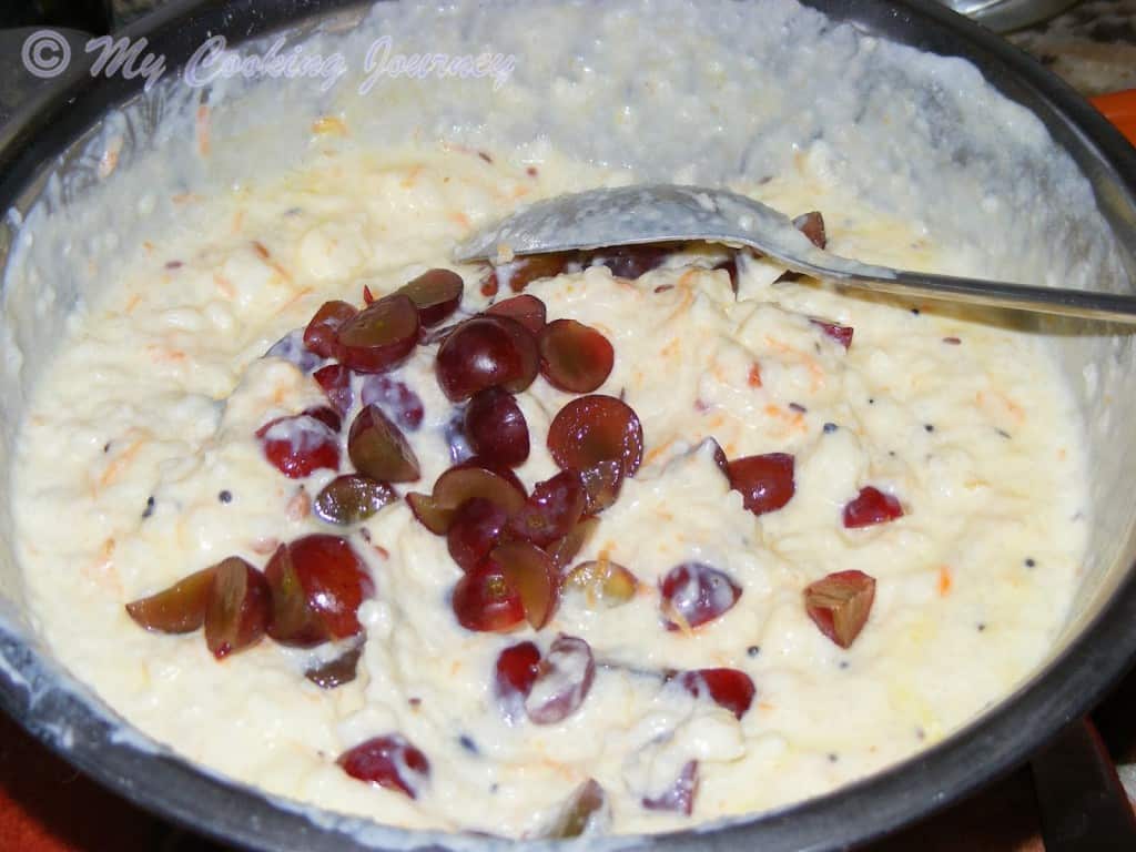 Adding chopped grapes to Curd Rice