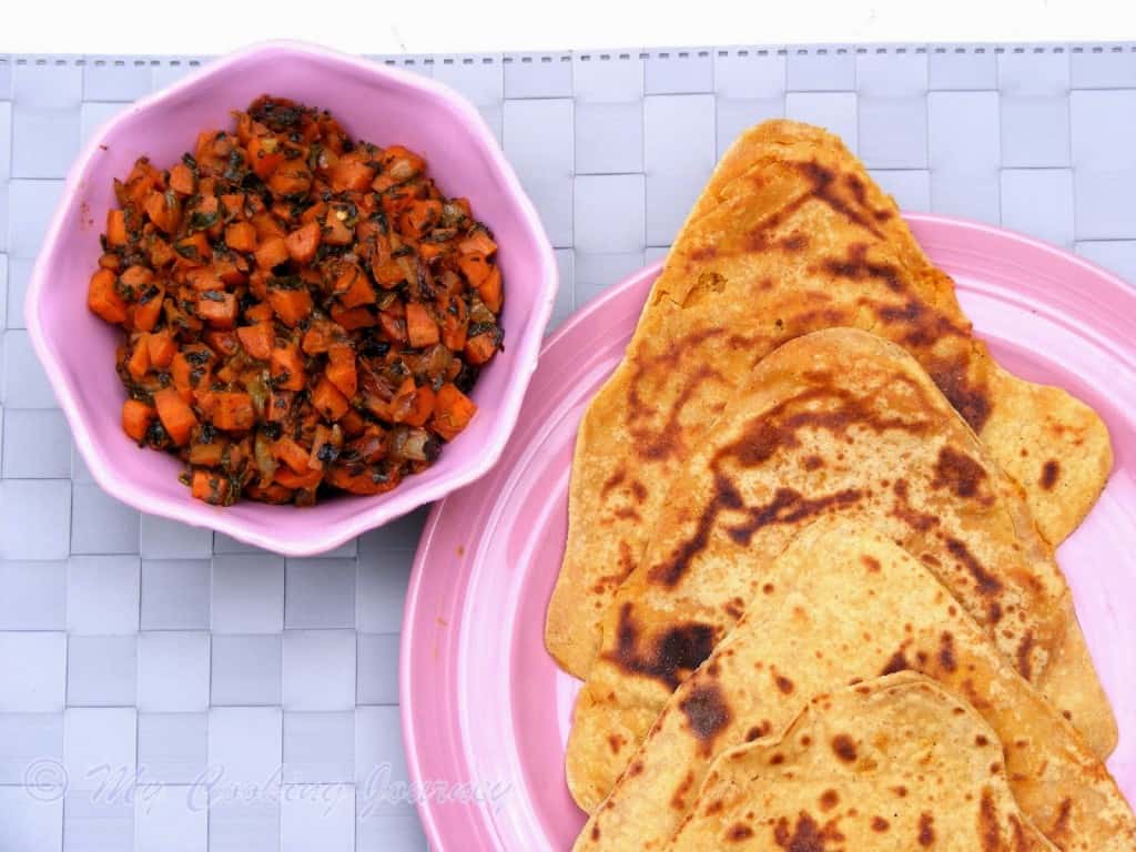 Haryana Besan Masala roti with Gajar methi subzi in a plate with bowl