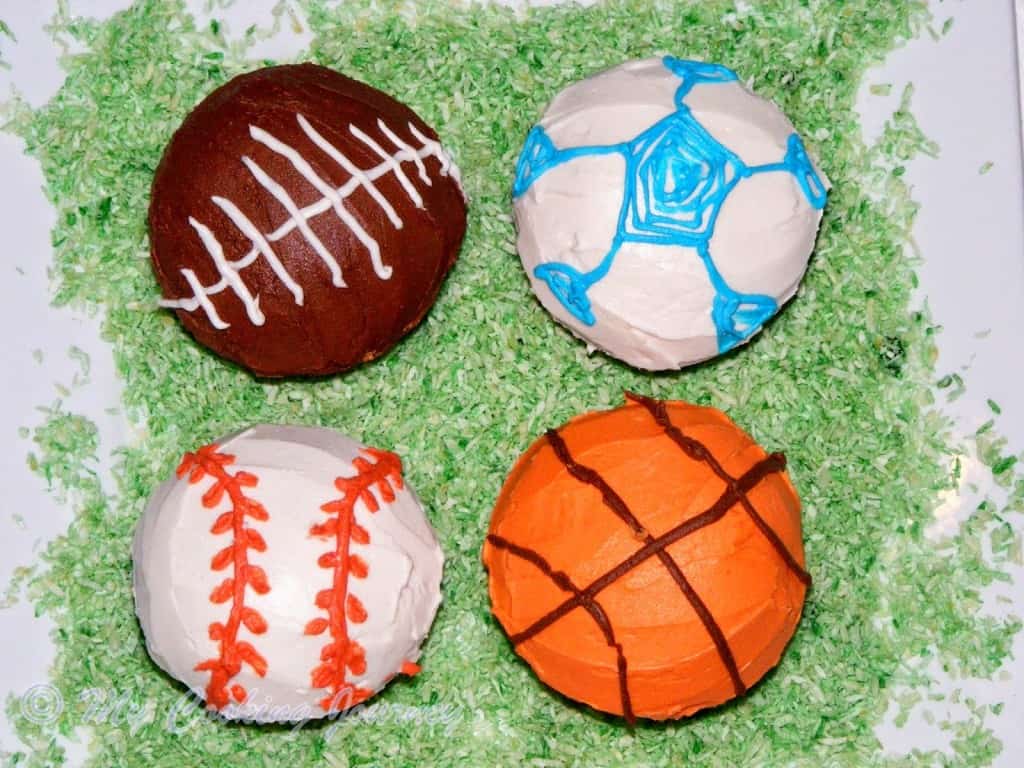 Vanilla Cupcakes sport ball shape with buttercream.