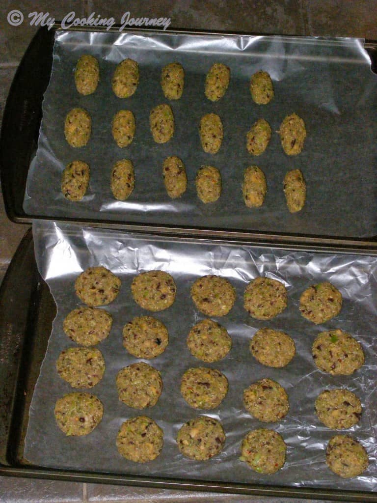 Broccoli Quinoa and Beans patties shaped and arranged on a baking tray