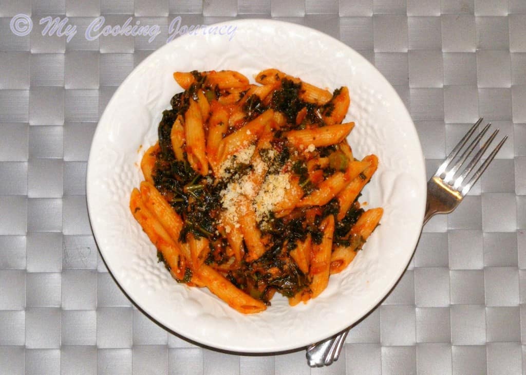 Kale and Tomato Pasta in white bowl