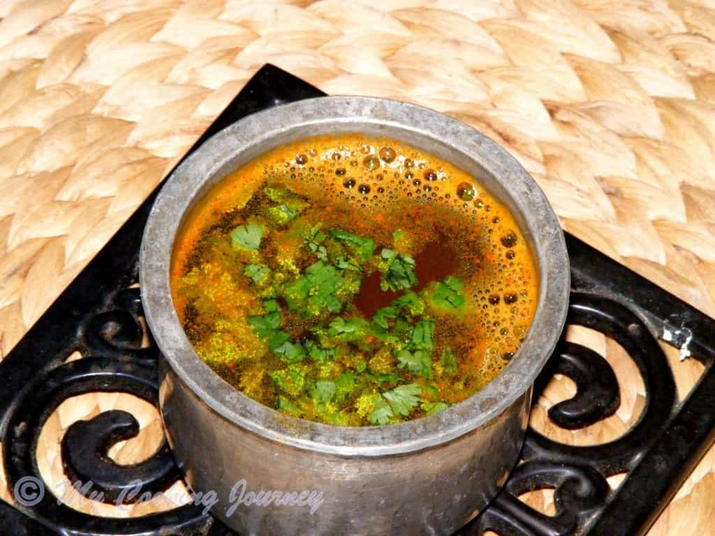 Thakkali Juice Rasam in a pot
