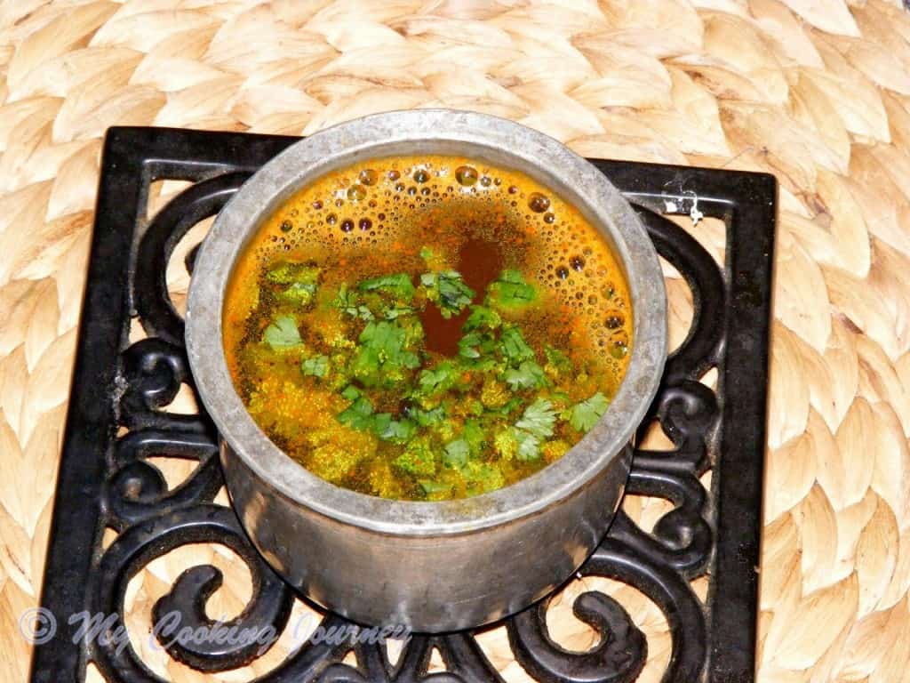 Thakkali Juice Rasam served in a pot