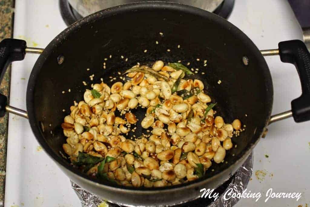 Adding curry leaves and  Frying sesame seeds