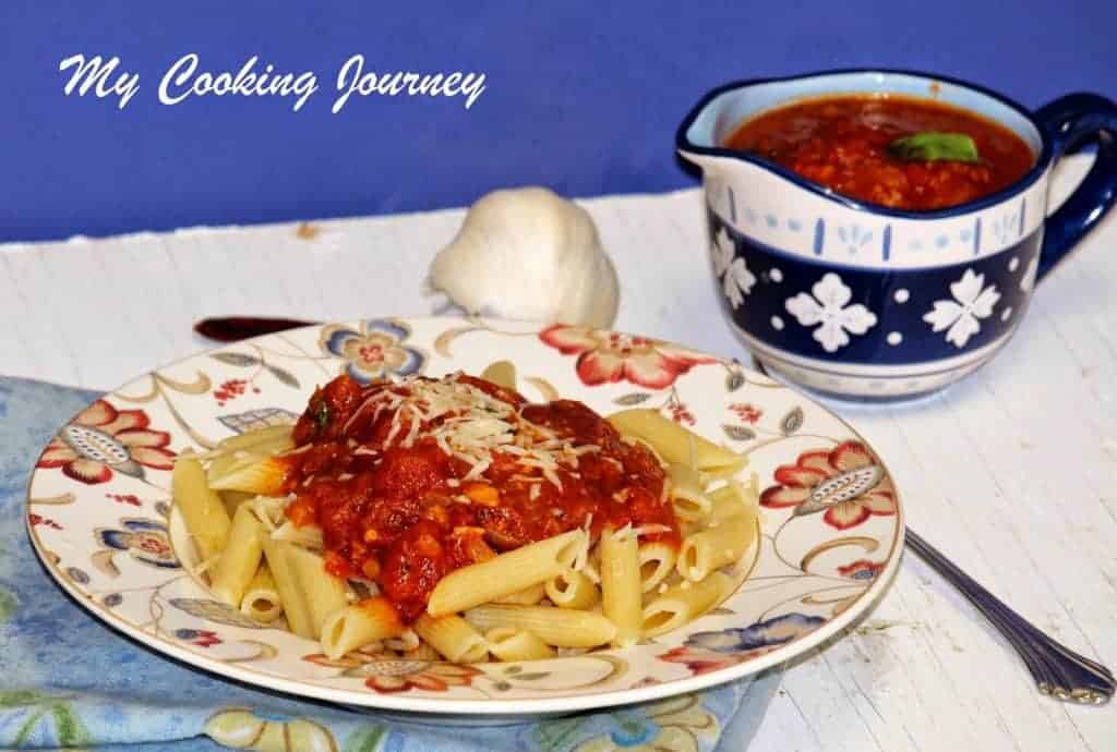 Penne All ‘Arrabbiata served in a plate  with sauce