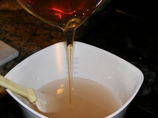 Preparing honey sauce for baklava