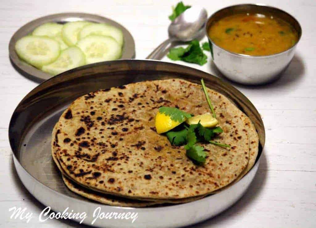 Gobhi Paratha with lemon in a plate