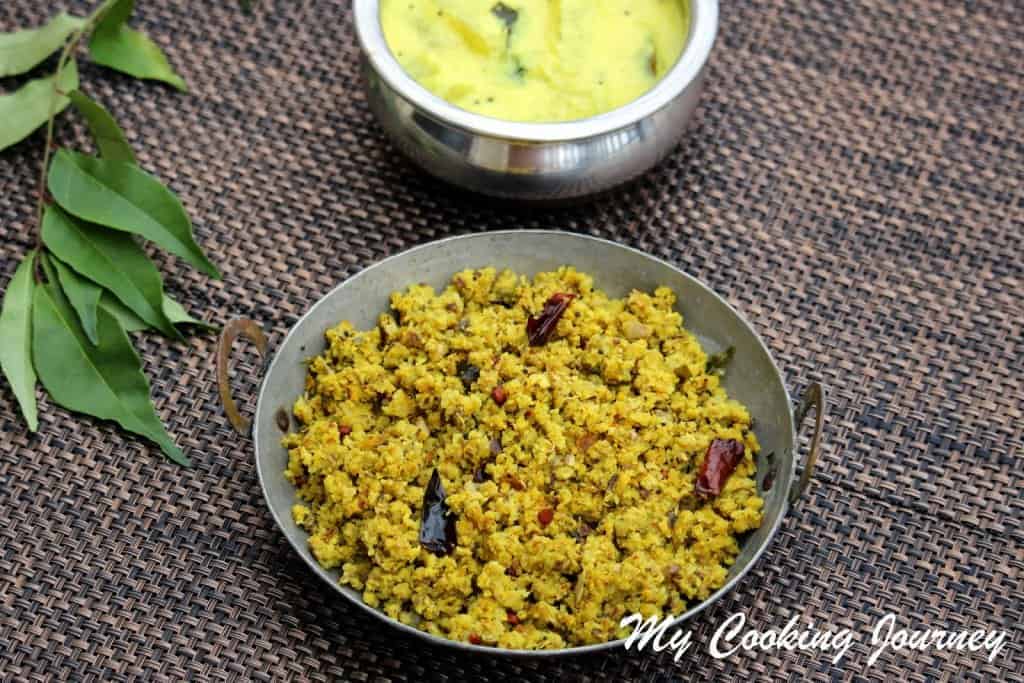 Vazhaipoo Paruppu Usili in Kadai with more kuzhambu in the background