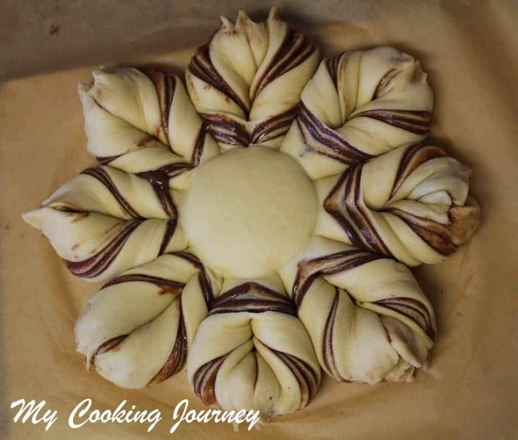 Shaped flower bread in a parchment paper