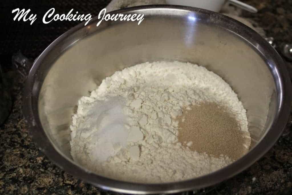 Mixing yeast and flour in a bowl