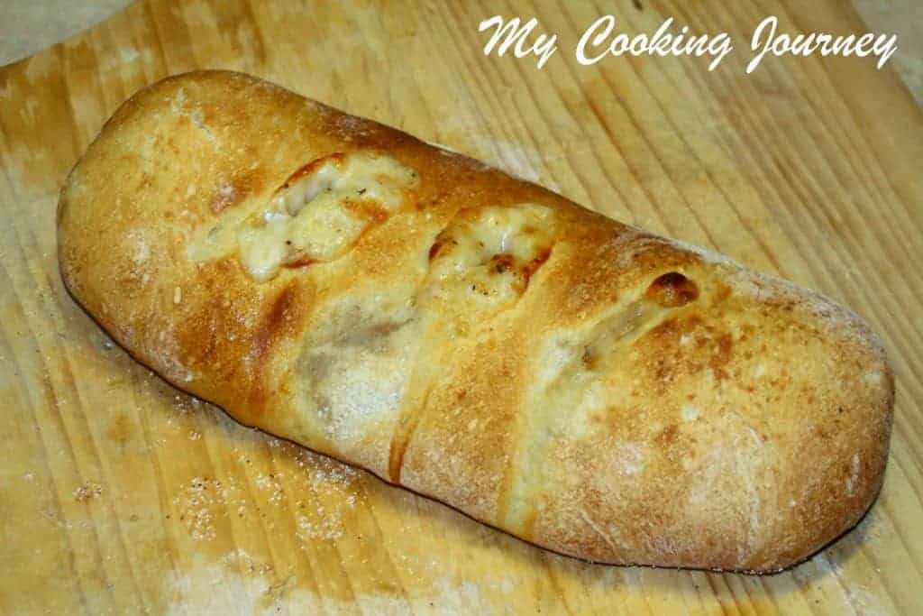Tomato Mozzarella and Basil stuffed Baguette is baked and golden