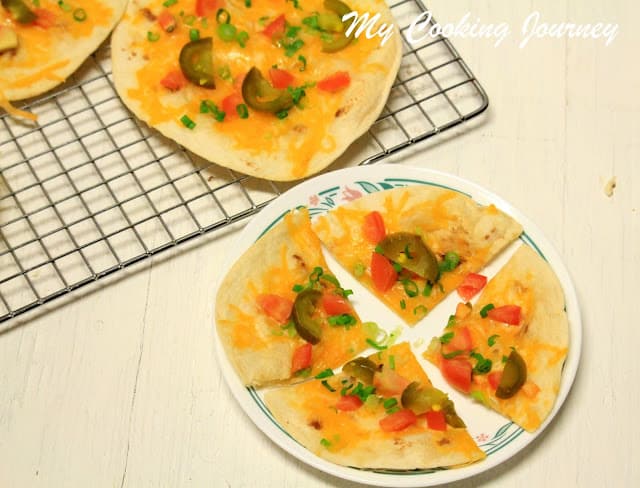 Arizona Cheese Crisps on cooling tray and white plate