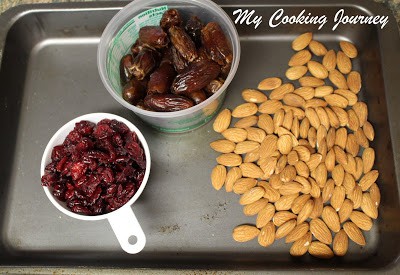 almonds. cranberries and dates in a tray