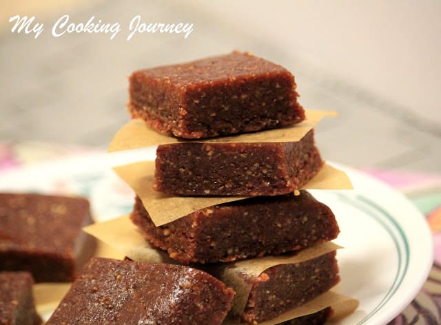 Energy bar stacked on top of each other with parchment paper in between