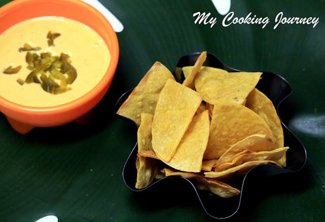 Tasty Tortilla chips with cheese sauce