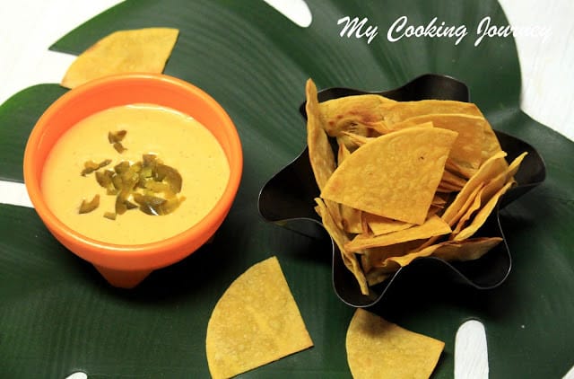 Tortilla chips with cheese sauce in a bowl