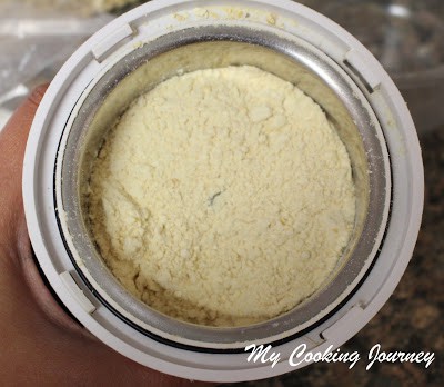 Grinding the pottukadalai in a grinder