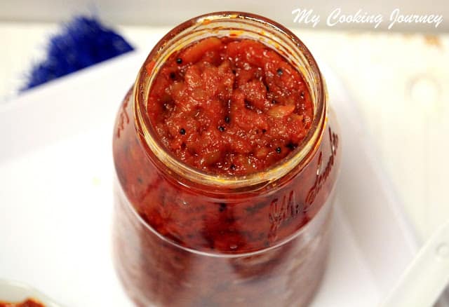 Transfer Mango Thokku pickle into glass jar