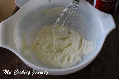 Mixing butter and suar with whisk