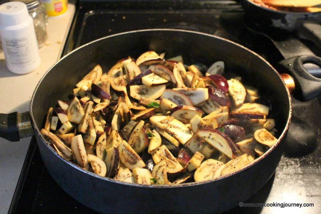 Frying the vegetable with ingredients in a pan.