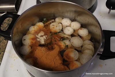Sambhar and vegetables in pressure cooker.