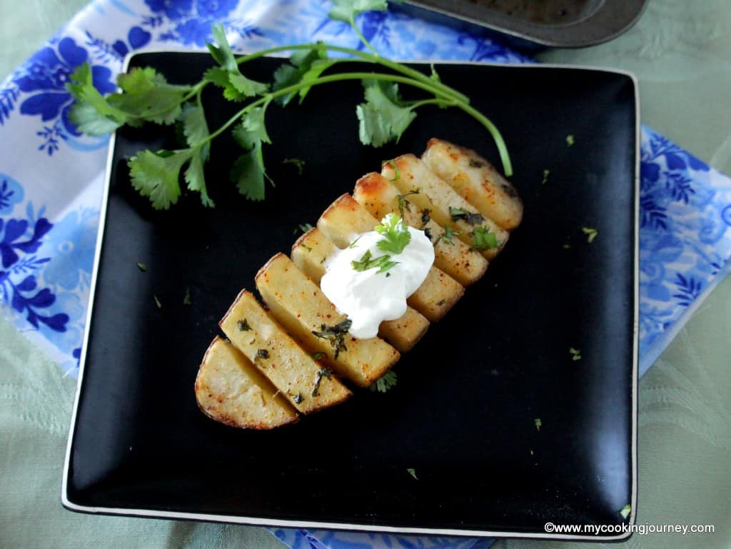 baked potatoes in a black plate