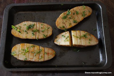 sprinkling cilantro on potato