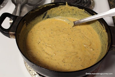 Mixing the ingredients in a kadai