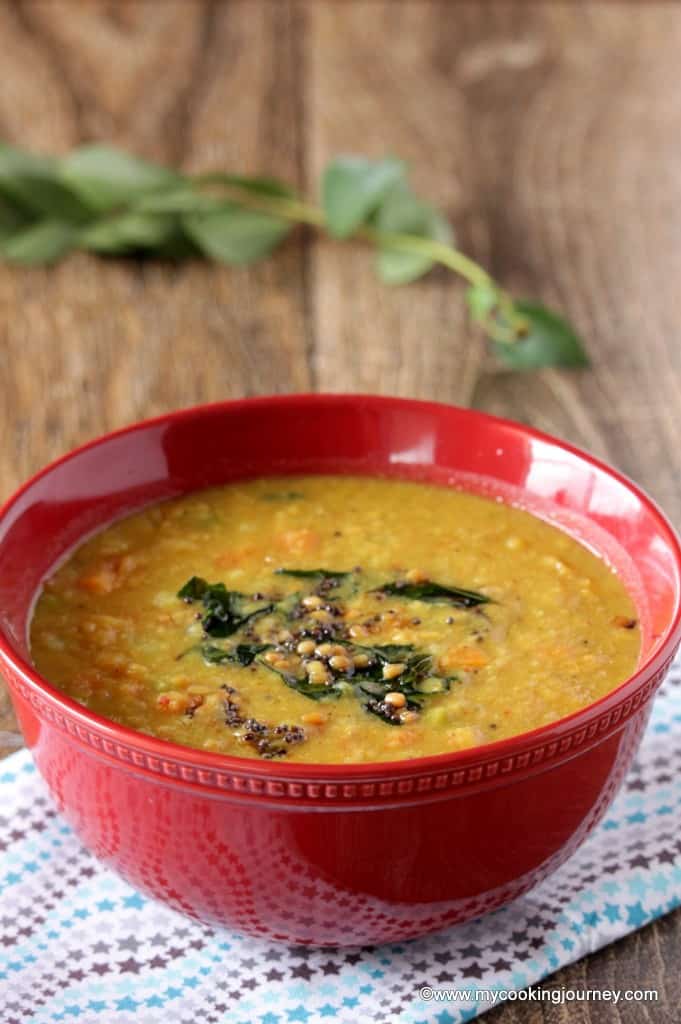 Mixed Vegetable Poricha Kuzhambu in a red bowl - Side view